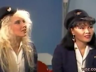 Three splendid flight stewardess in one scene